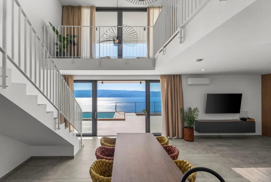 Modern dining table located within a spacious 60-square-meter living area.
