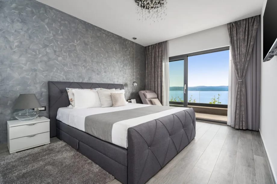 Bedroom 1 with king-size bed, air conditioning and en-suite bathroom