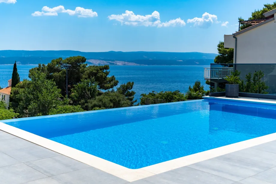 Private 32sqm heated pool with 6 lounge chairs