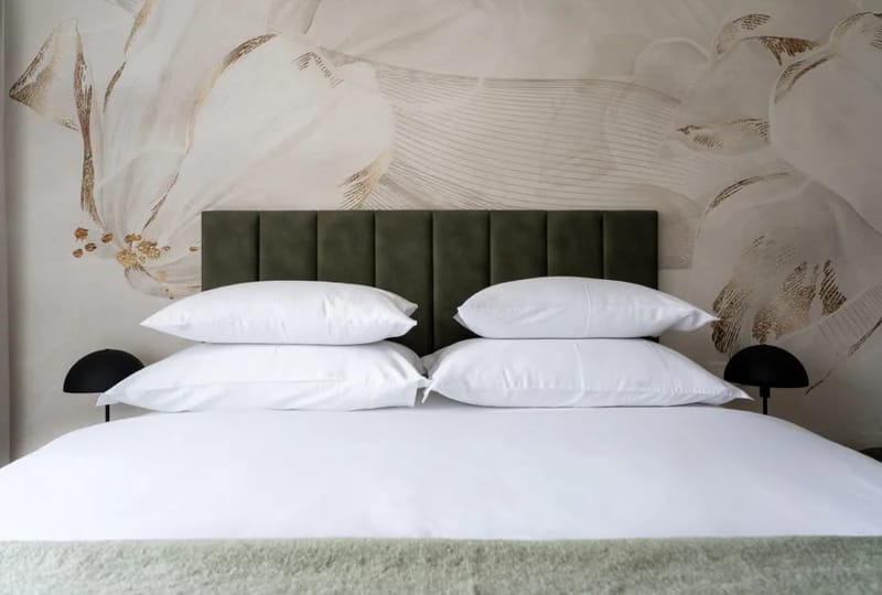 Bedroom with a queen-size bed and TV.