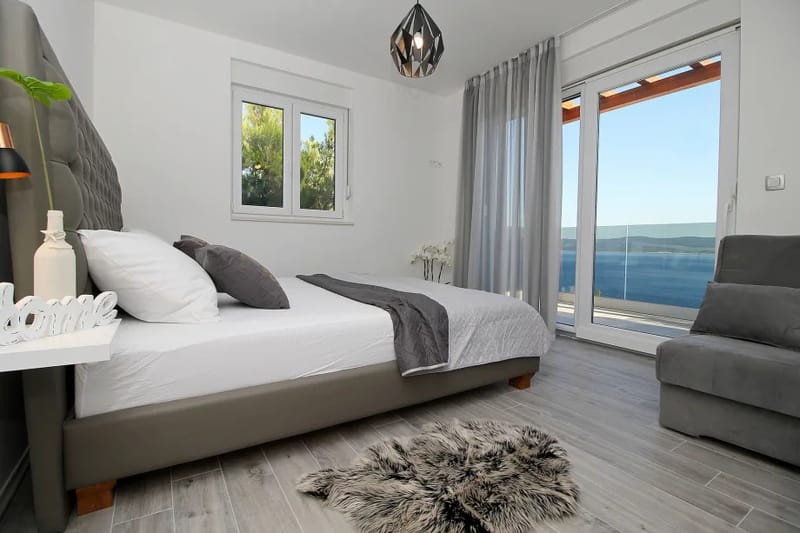 Bedroom on 1st floor with double bed and sofa bed, exit to the balcony