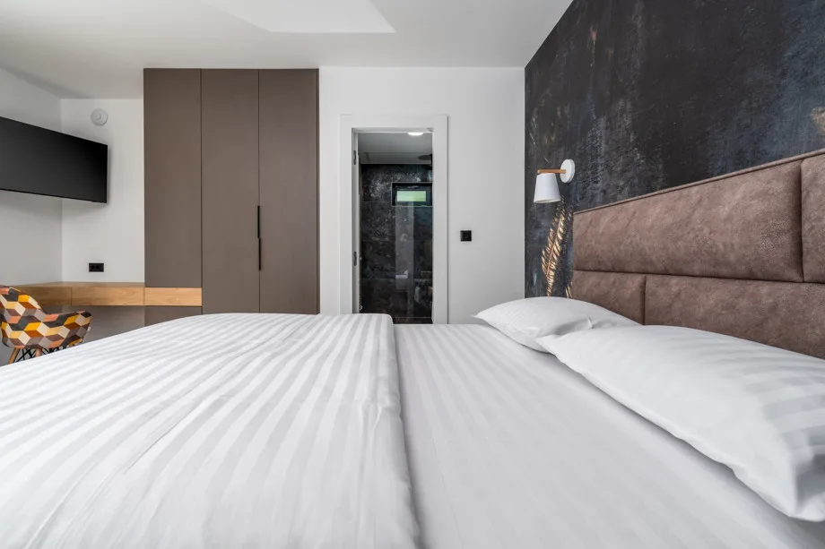 Detached, but also on the ground floor is a Bedroom No1 with a queen size bed 160cm x 200cm, air-conditioning, a TV, en-suite bathroom with the shower