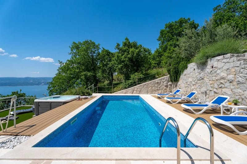 Private swimming pool with sun deck