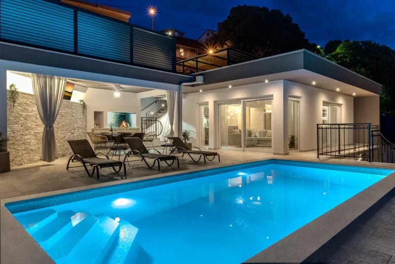 Sun deck area with 6 deck chairs and an outdoor shower