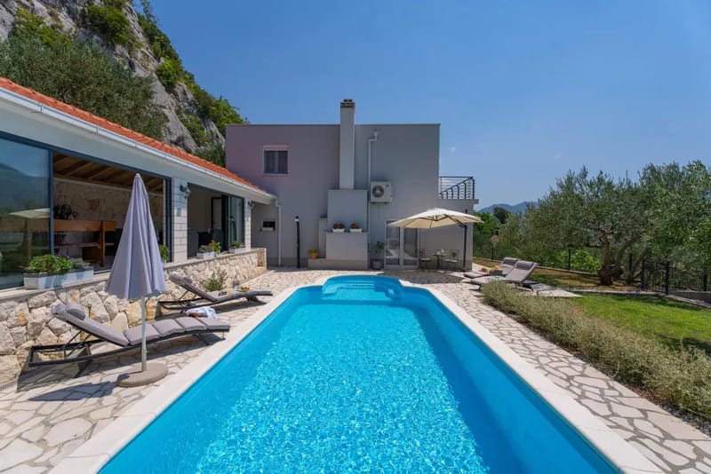 Sun deck area with 4 deck chairs and private pool