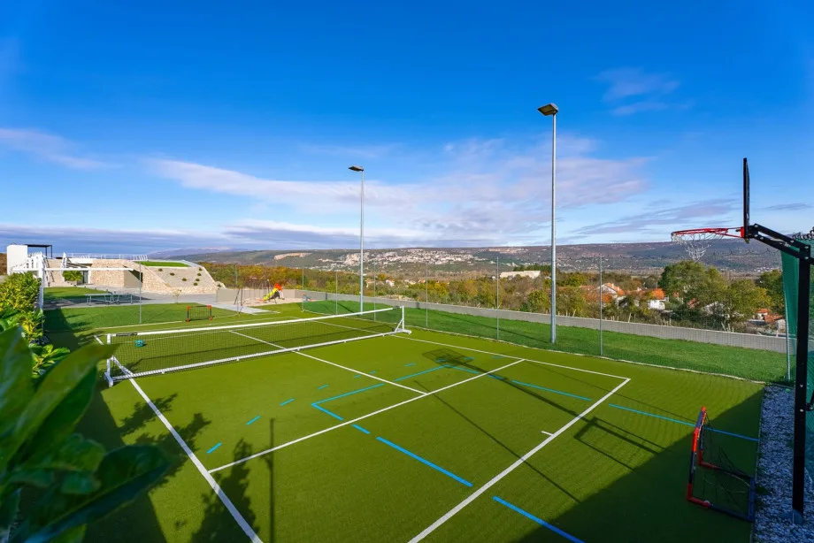 Multi court (mini football, tennis and basketball court) with a ball gate and basket