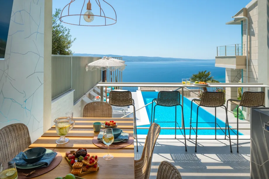 Summer kitchen with barbecue and covered dining space