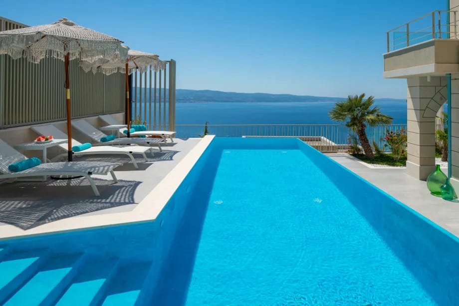Casa GÈNI with a heated pool, three bedrooms, an organic garden, and sea views