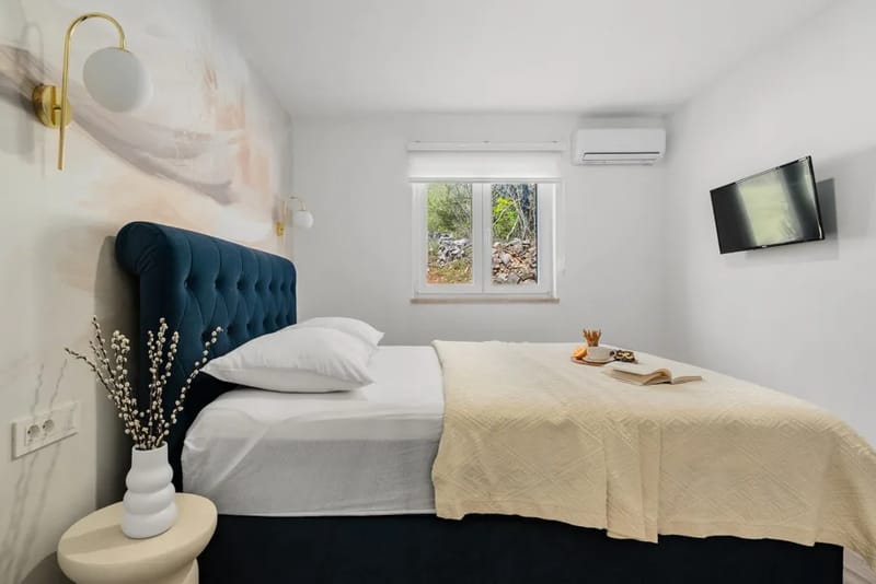 Bedroom 1 with a queen-size bed and en-suite bathroom.