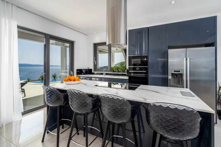 Modern fully equipped kitchen with access to the pool area
