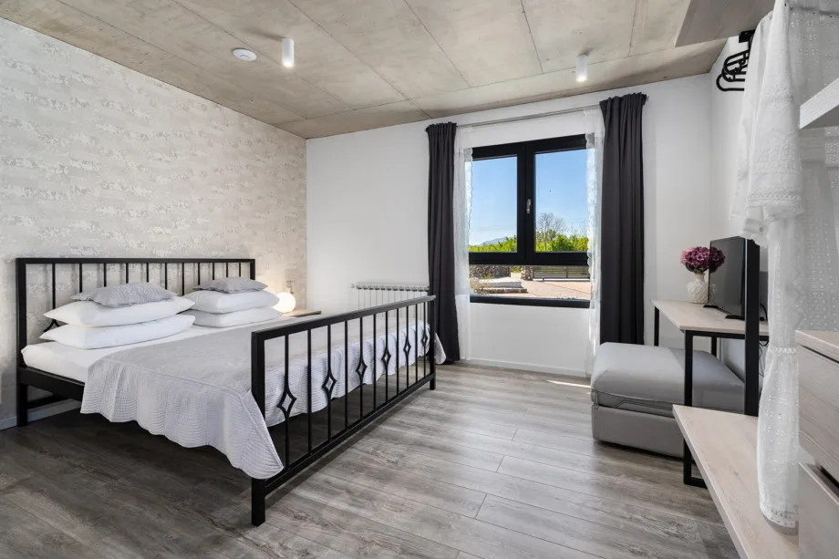 Dormitorio 3 con cama king size y sofá cama