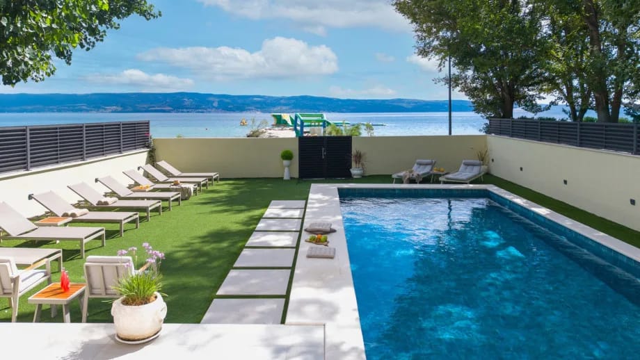 Sun deck with 14 deck chairs, outdoor shower and summer kitchen