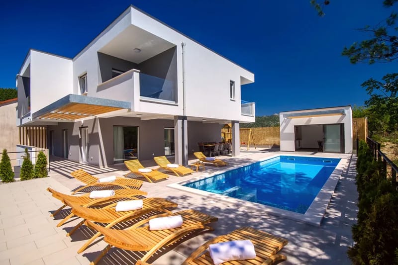 Villa Tela con piscina climatizada de 33 m², zona de hidromasaje anexa de 5 m², sauna y cocina de verano