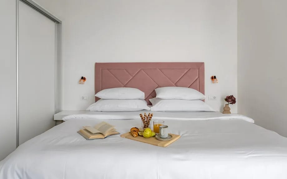 Bedroom 5 with a king-size bed, en-suite bathroom, and balcony