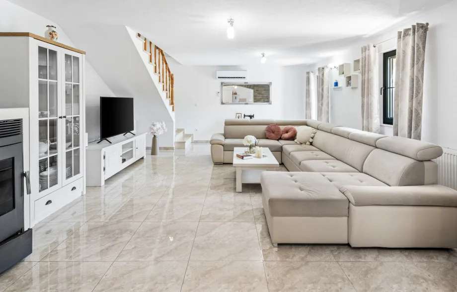 The ground floor offers a spacious living and dining area