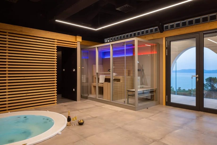 The wellness area includes a whirlpool, Finnish sauna, steam bath cabin, relaxing room, and heated bench.