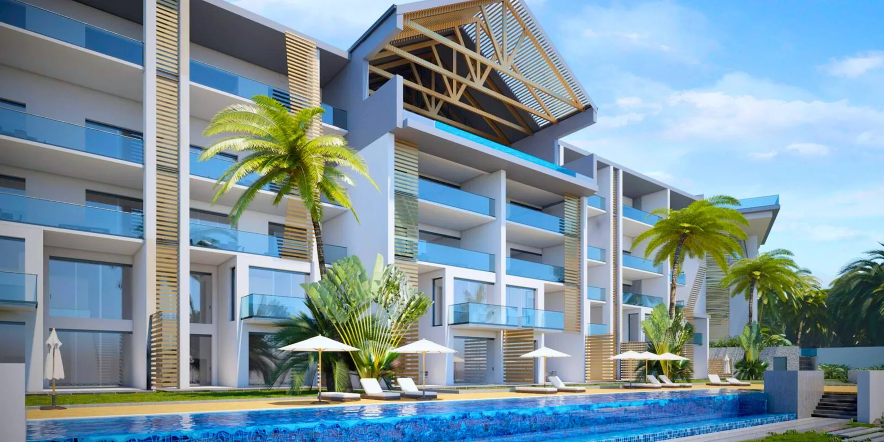 A modern multi-story building stands beside a swimming pool and palm trees.