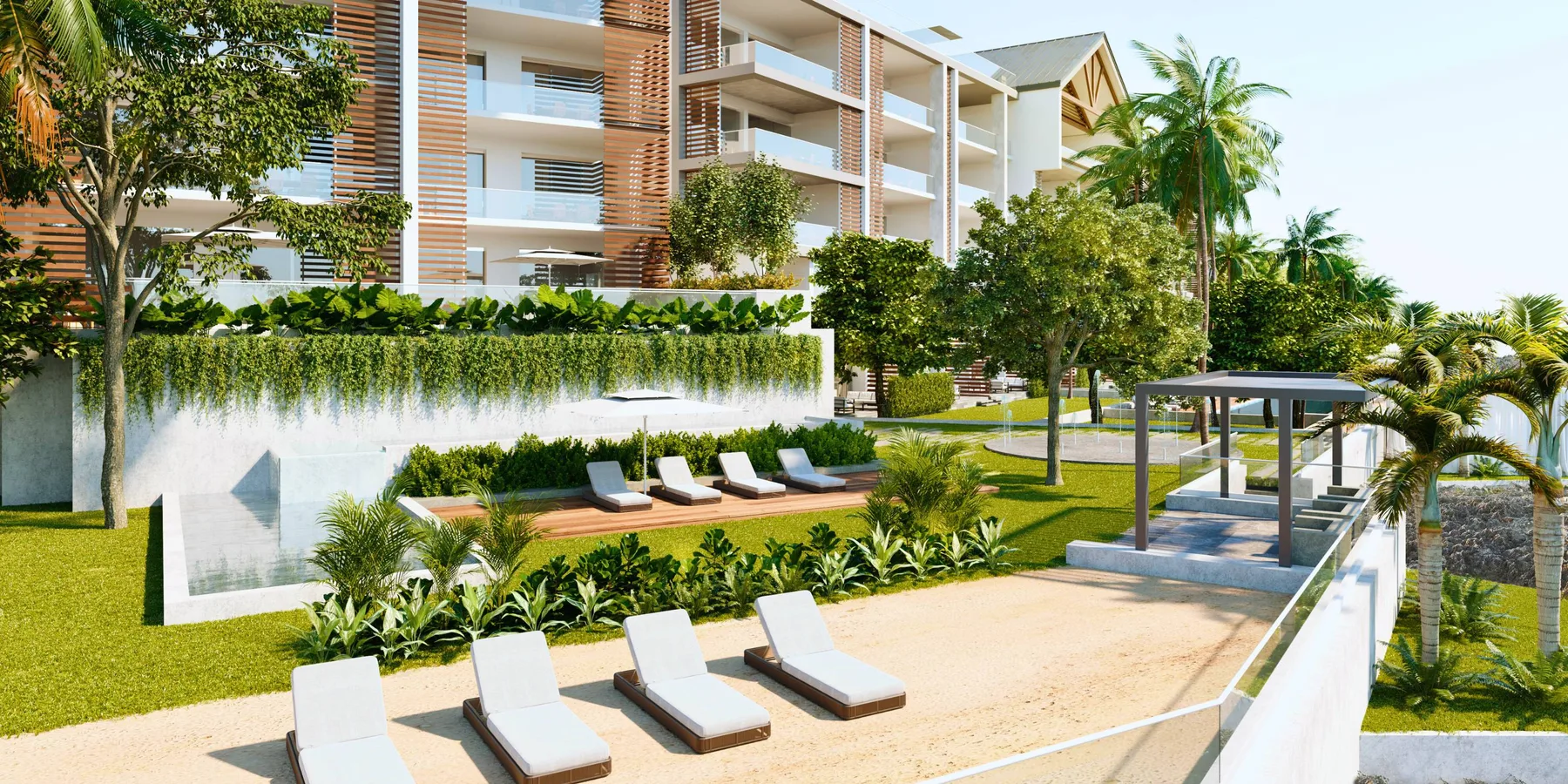 A landscaped outdoor pool area features lounge chairs beside a modern apartment building.