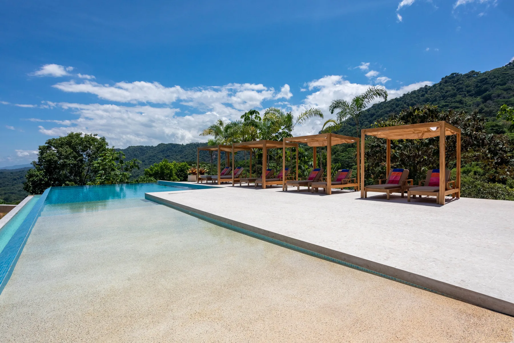 Infinity pool with cabanas