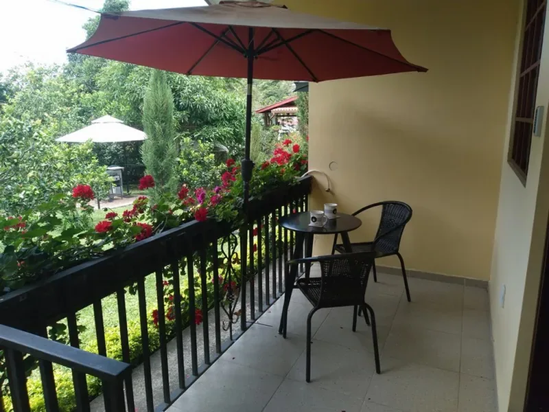 Private terrace with table, chairs and parasol