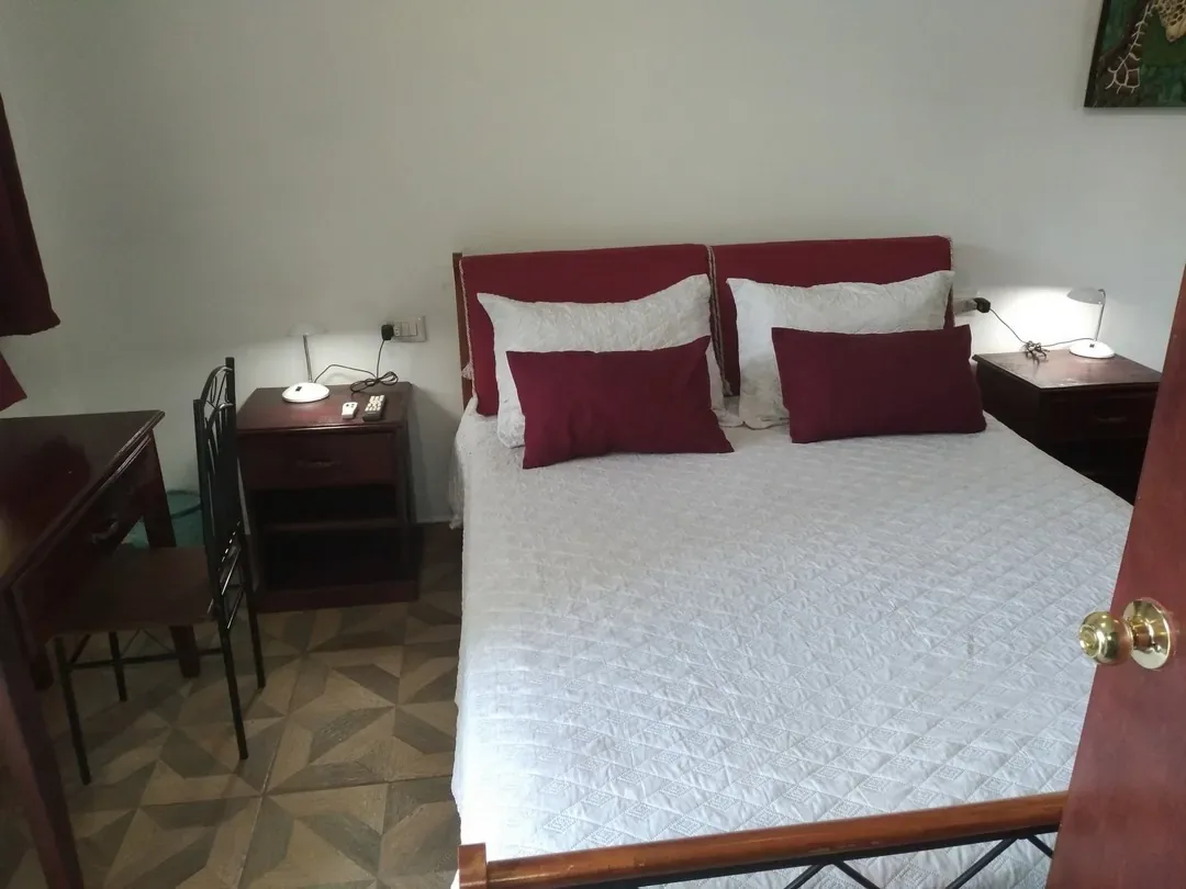 Queen bed with nightstands and reading lamps