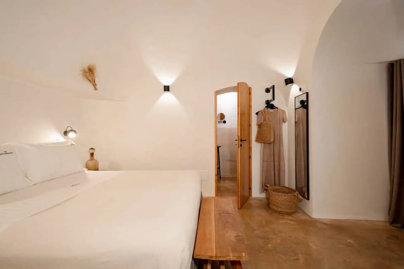 Bedroom beneath a stone arch