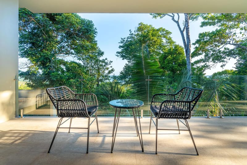 Colíbri Sur · 14. This private outdoor terrace provides contemporary seating for two with views across the lush tropical canopy to the distant ocean.