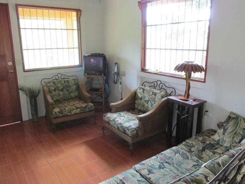 Living area with sofa and armchairs