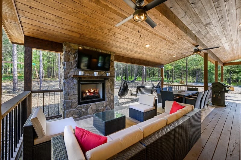 Covered outdoor living room and fireplace