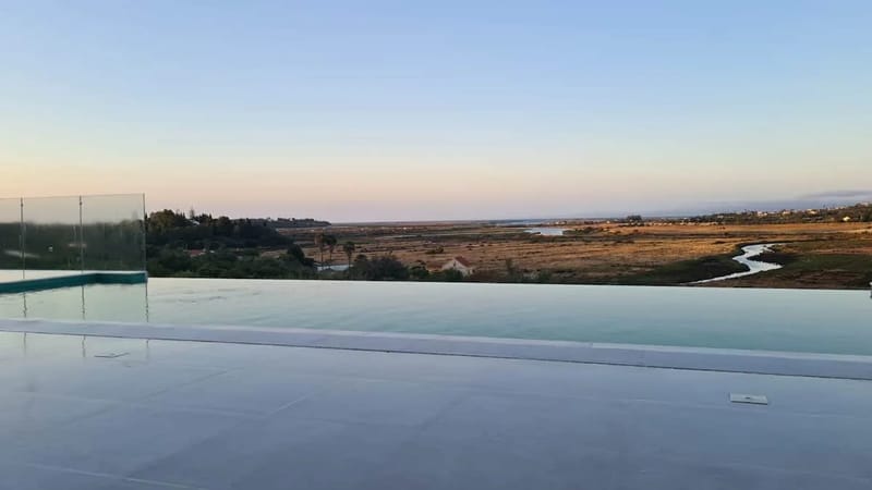 Infinity pool and estuary view
