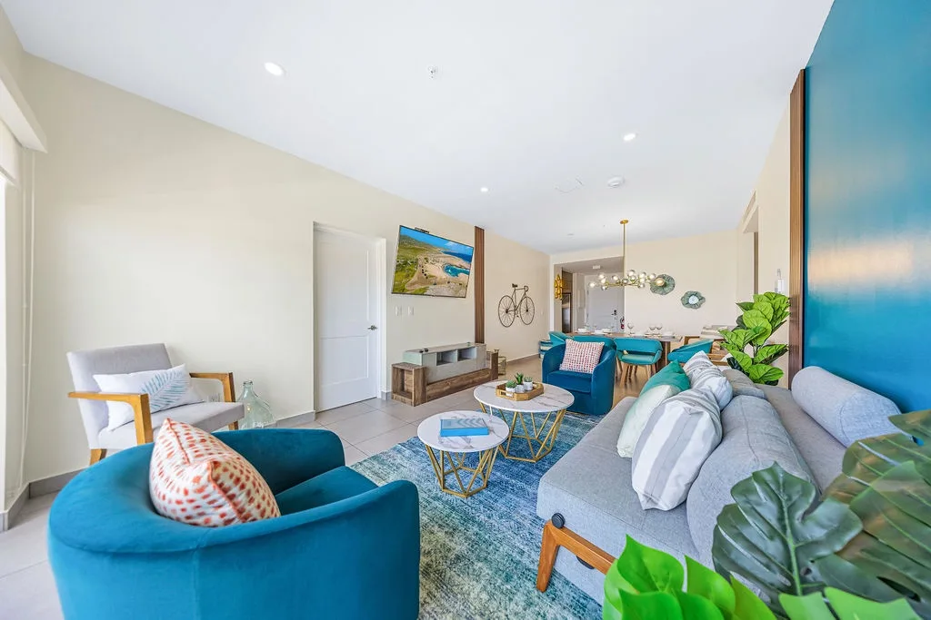Sink into plush seating, catch your favorite shows, and sip morning coffee in this bright, open-plan living space designed with your comfort in mind.