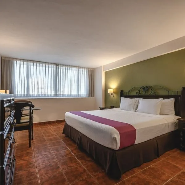 Habitación superior con una cama king