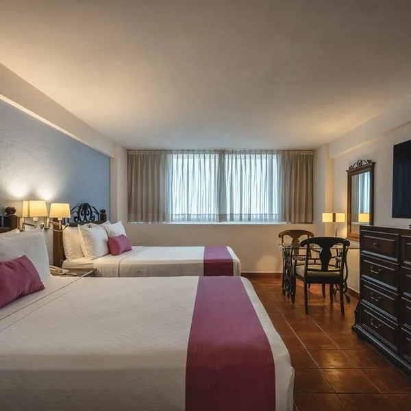 Habitación superior con dos camas dobles