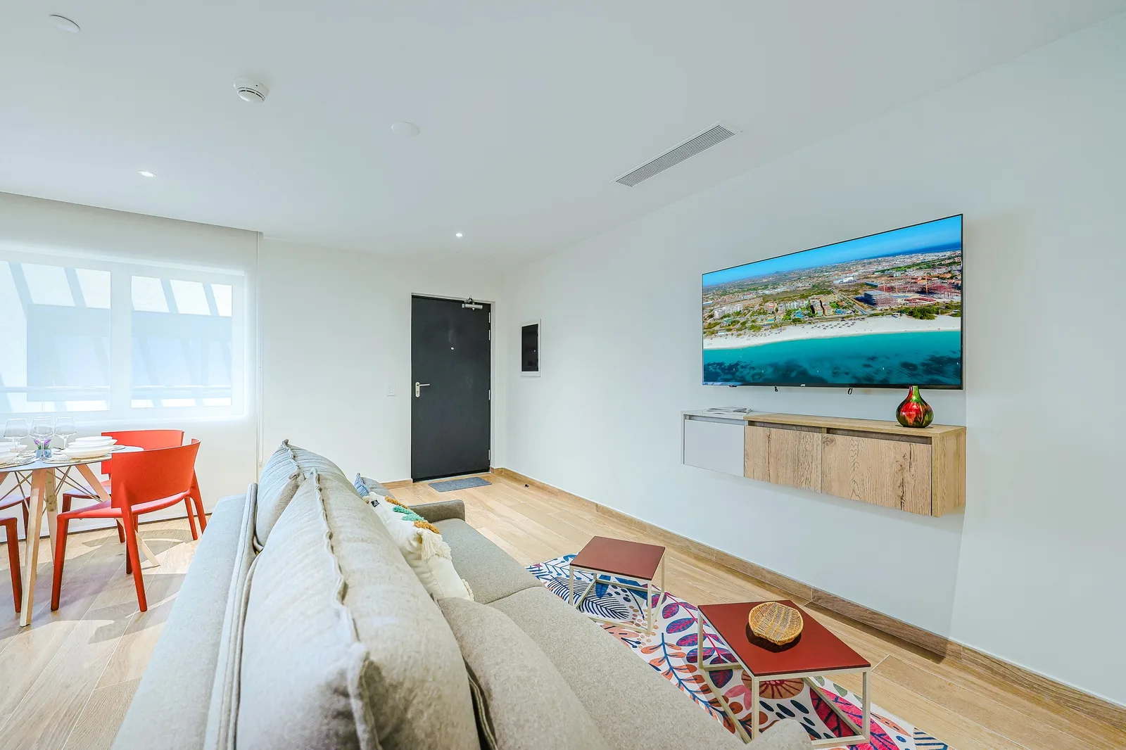 Step into your bright, open living space where comfort meets modern style. Sink into the plush sofa, enjoy meals at the vibrant dining table, and let the natural light energize your getaway.