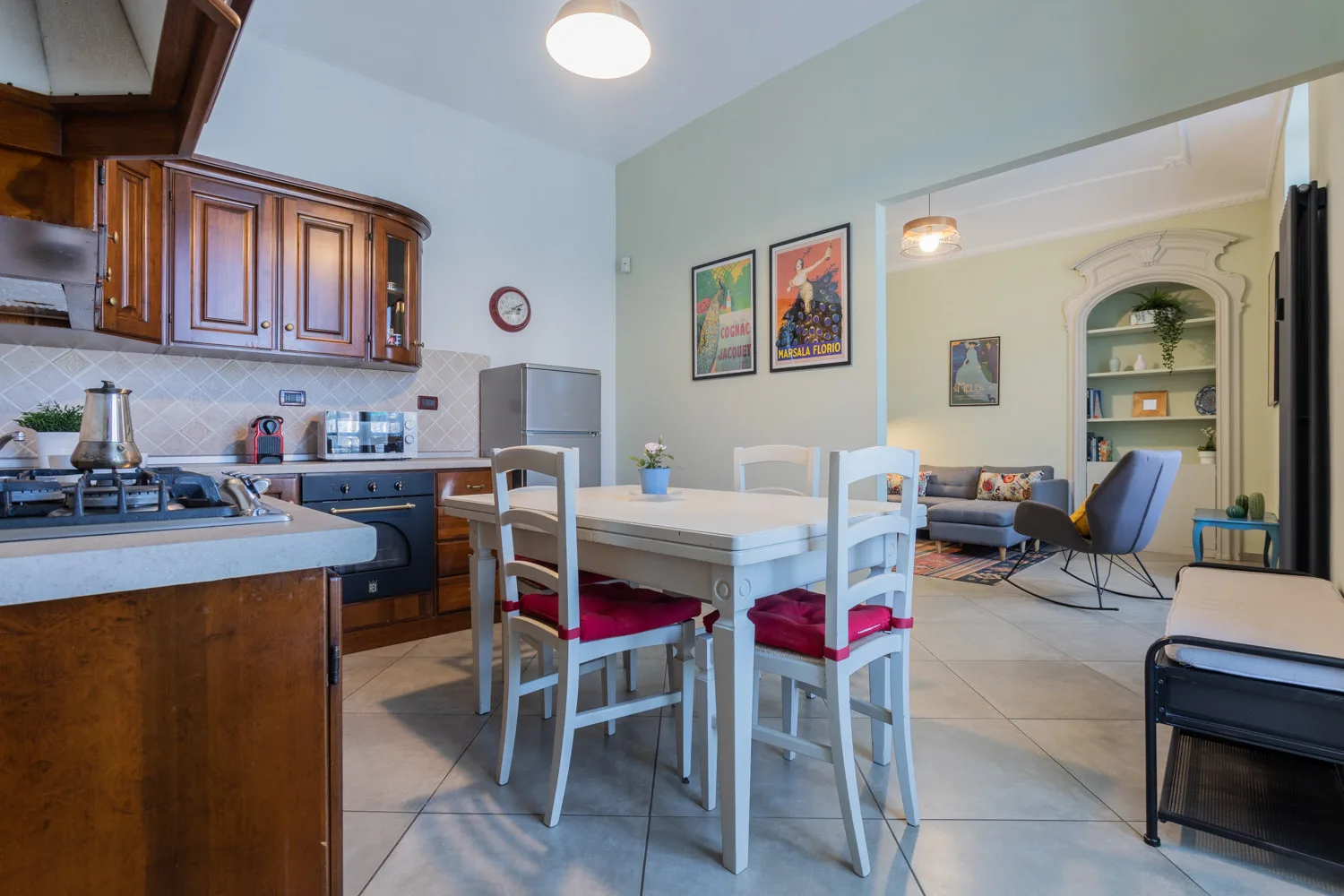 An open kitchen and dining area with a table and seating.