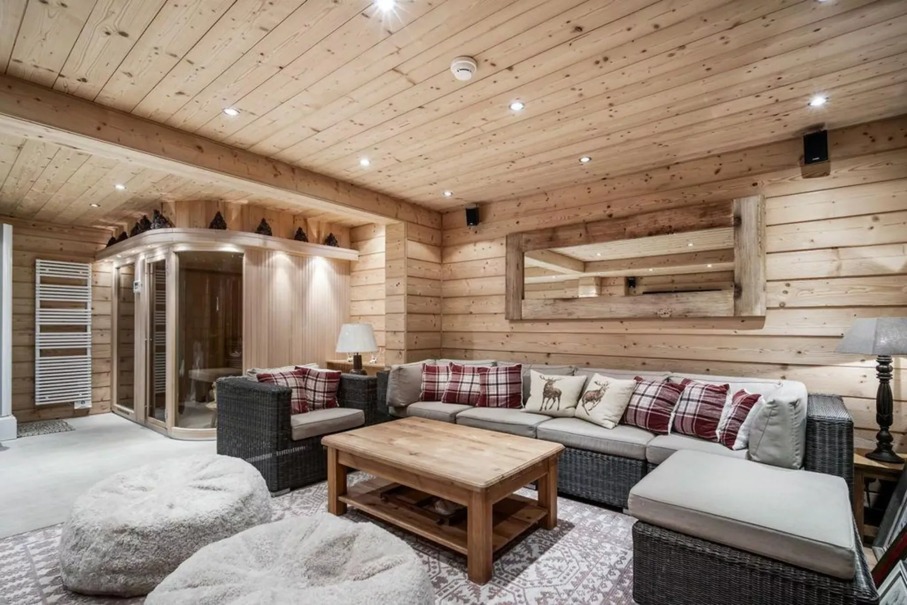 A wood-paneled lounge with cushioned seating and a low wooden table.