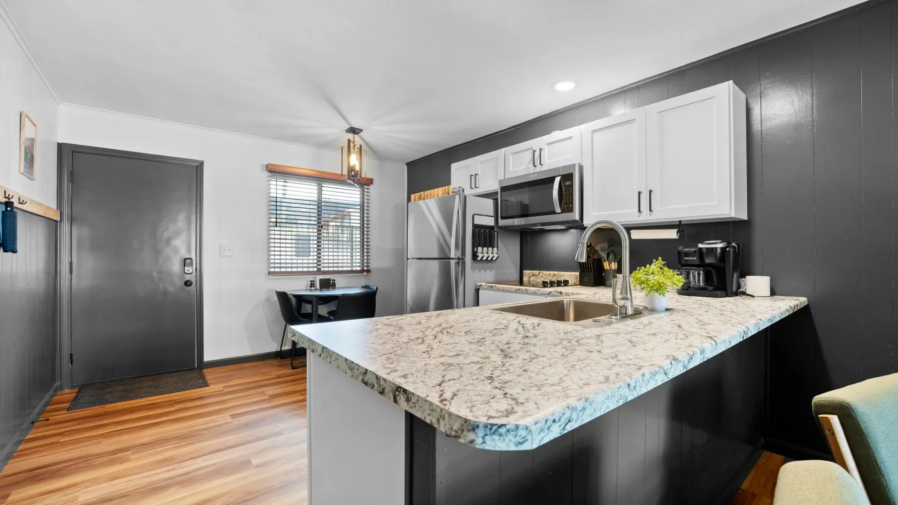 Kitchen with gray cabinets and an island