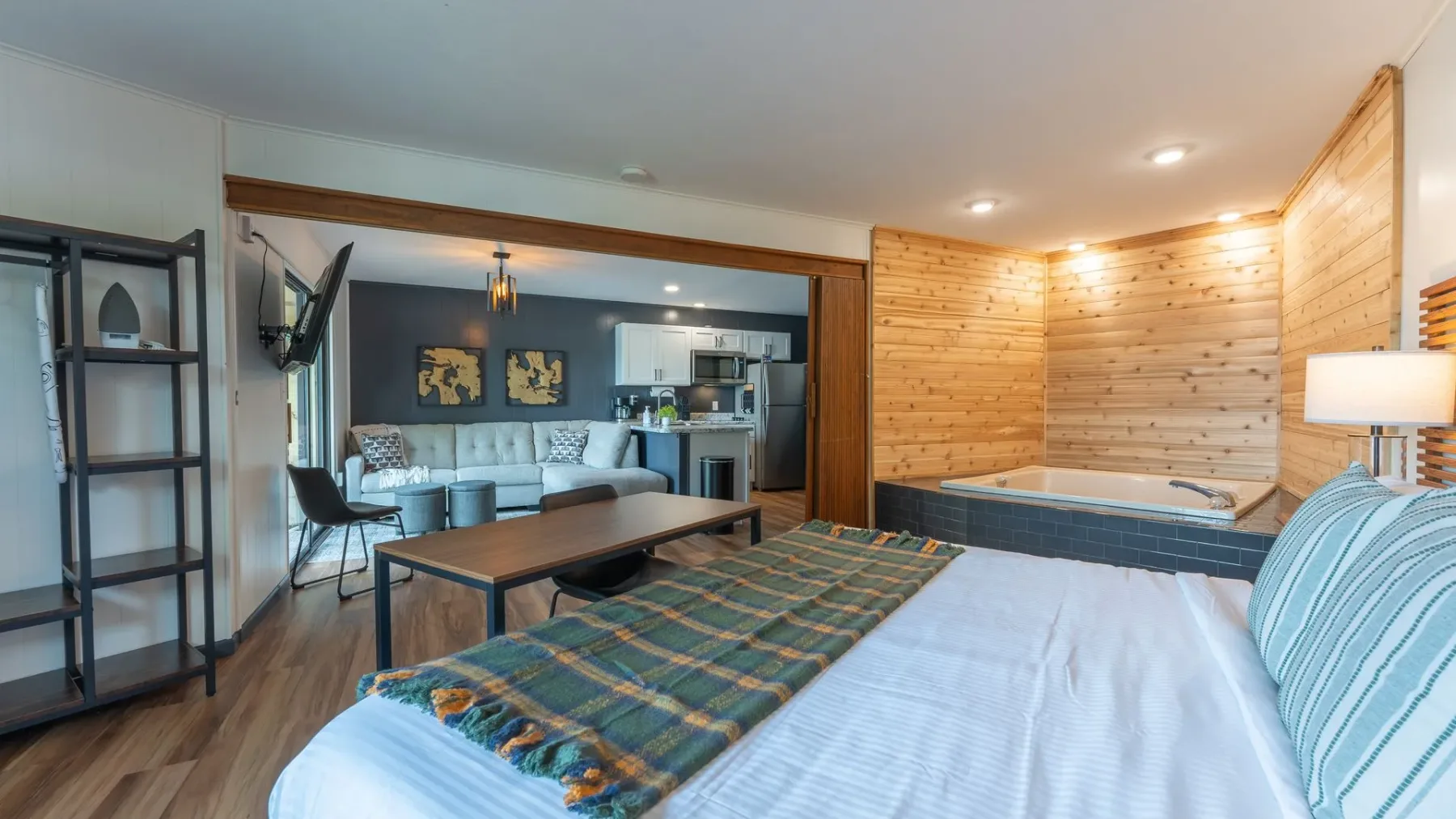 Bedroom with wood accent wall and desk