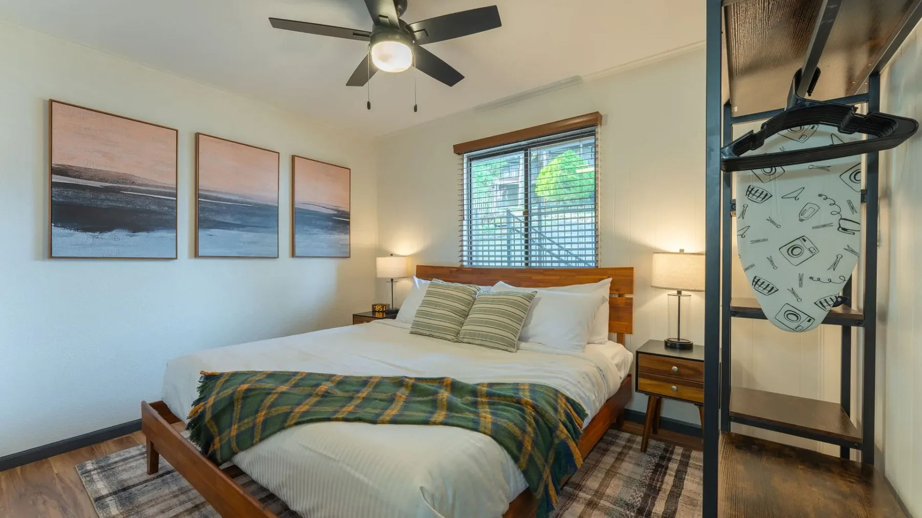 Bedroom with a wooden bed and bedside lamps