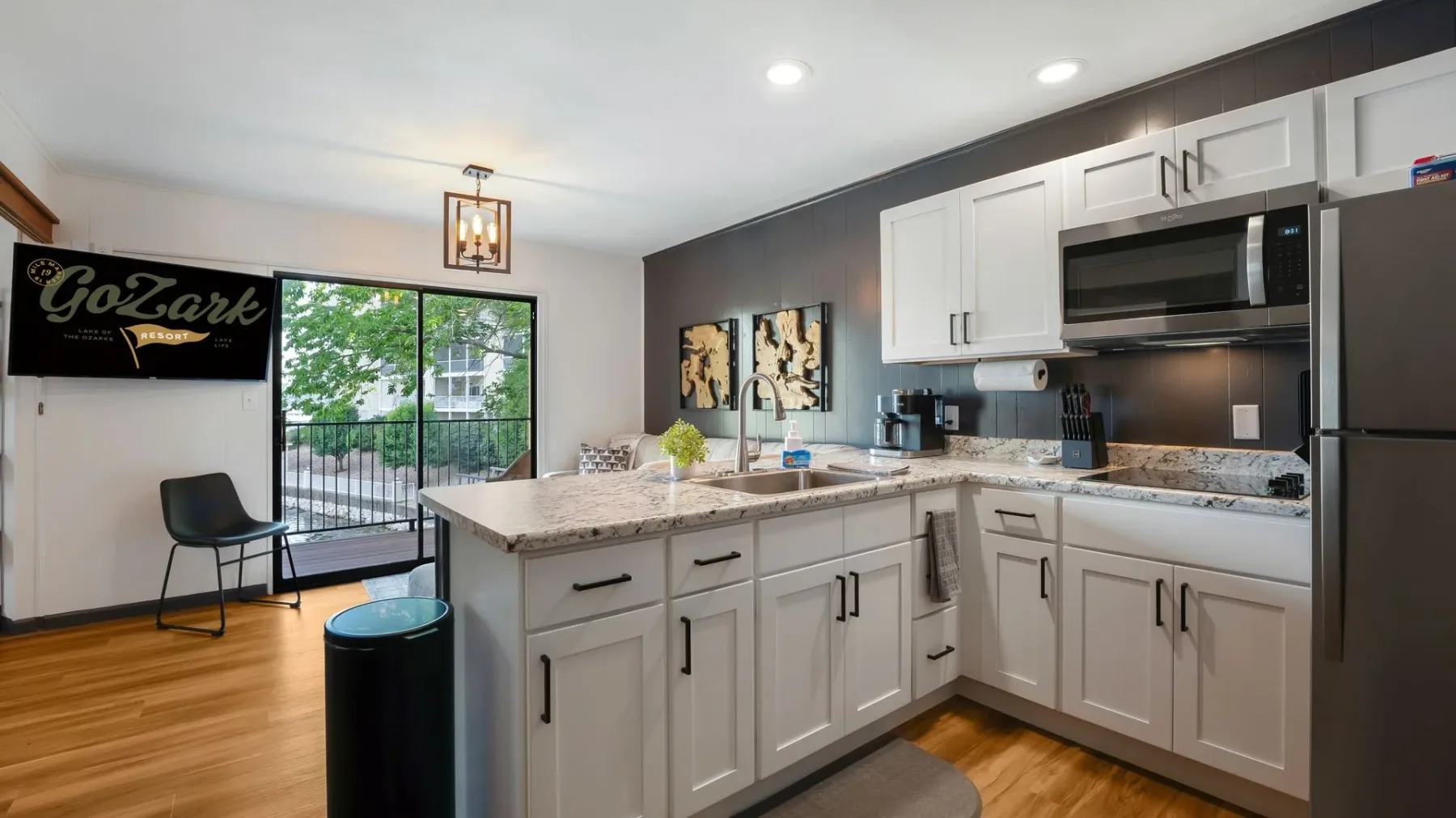 Kitchen with island and sliding door to patio