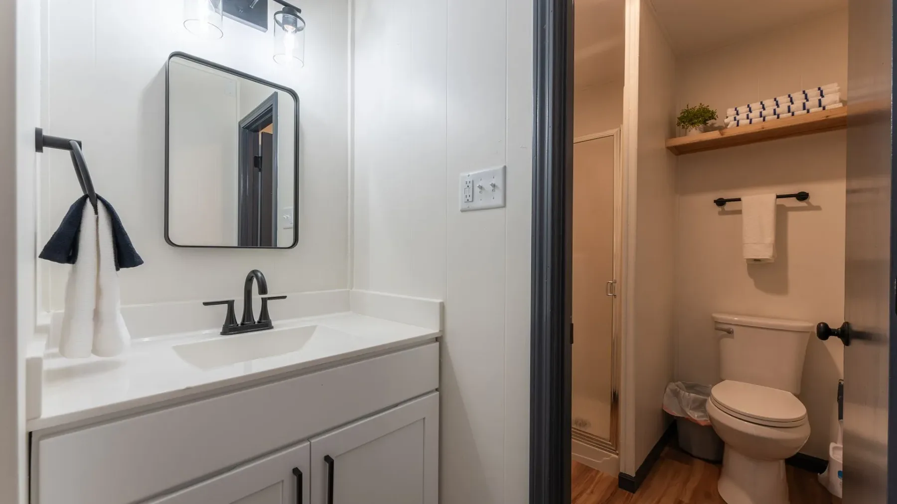 Bathroom vanity and toilet alcove