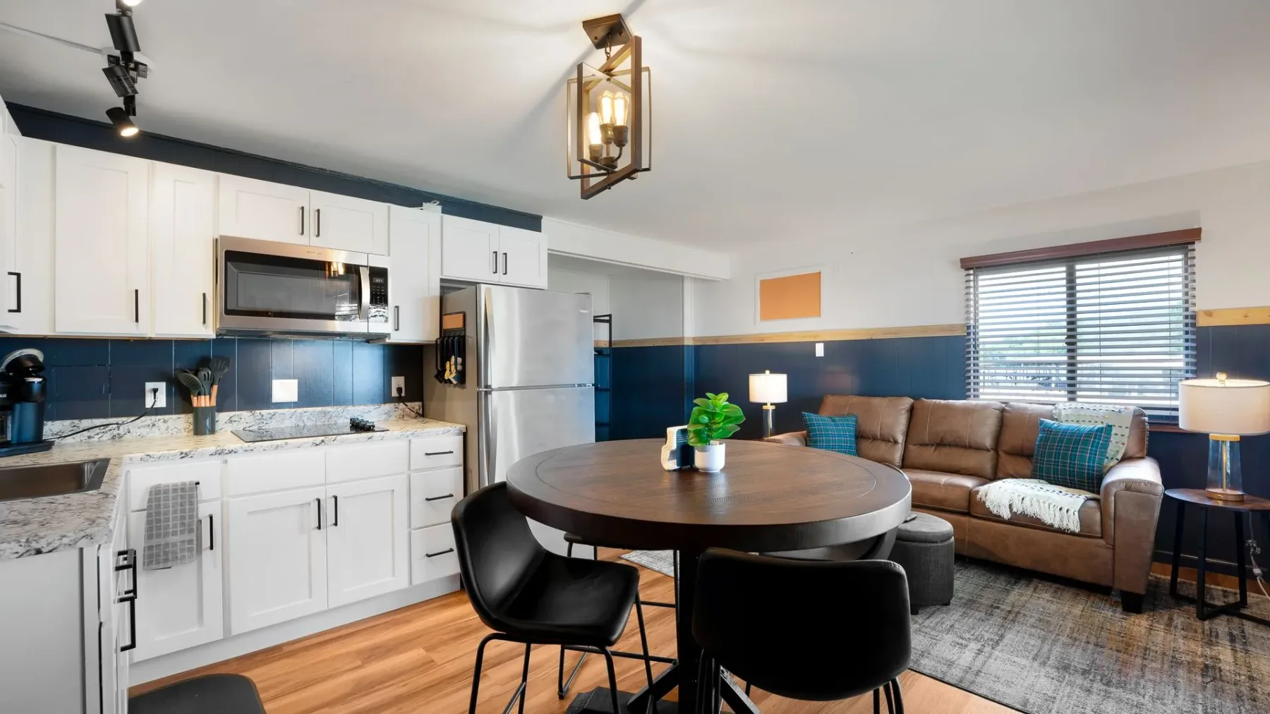 Kitchen and living room with round dining table