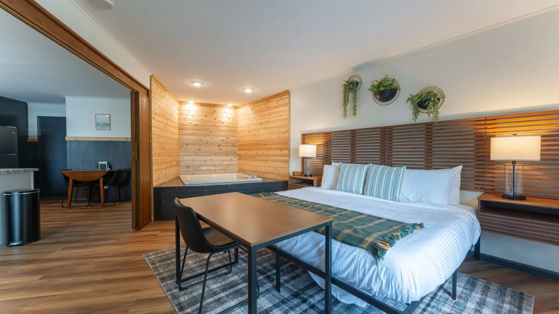 Bedroom with king bed and brick accent wall