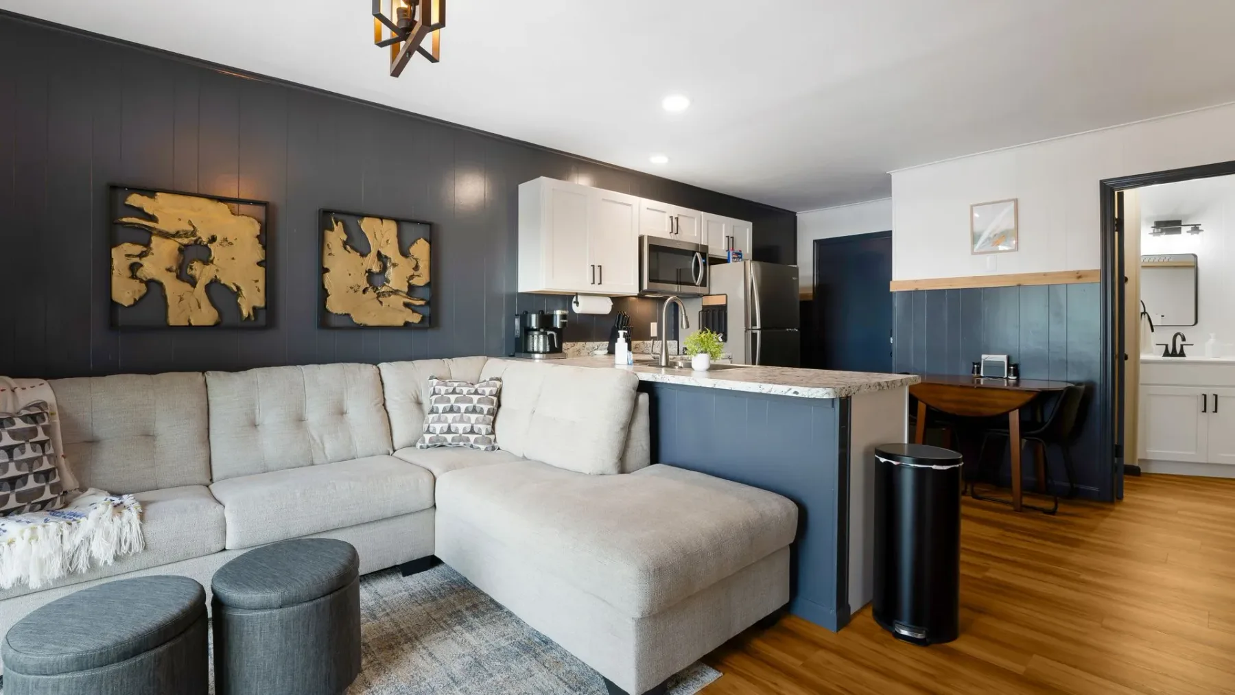 Living room with sectional sofa and kitchen counter