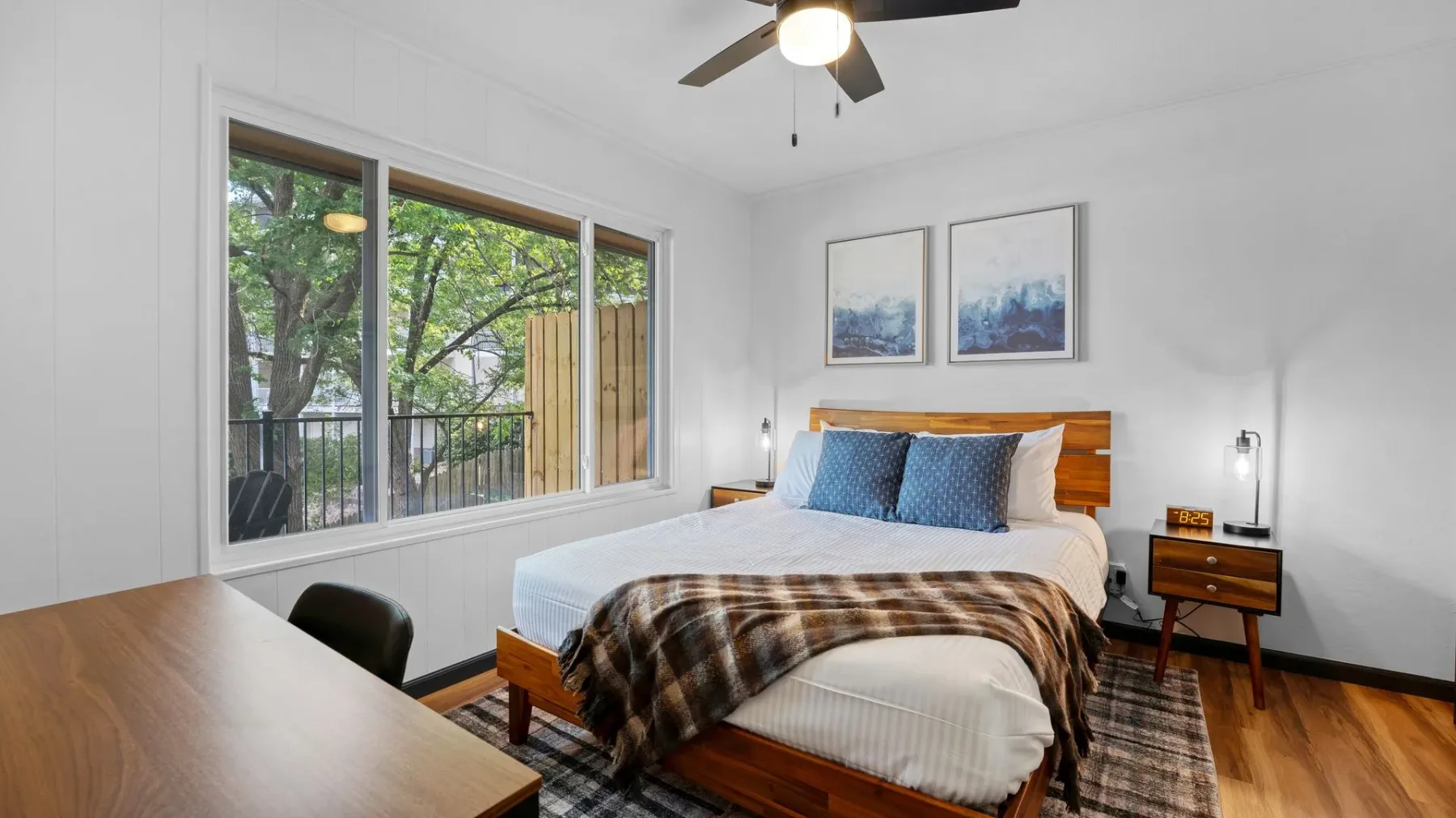 Bedroom with desk and large window
