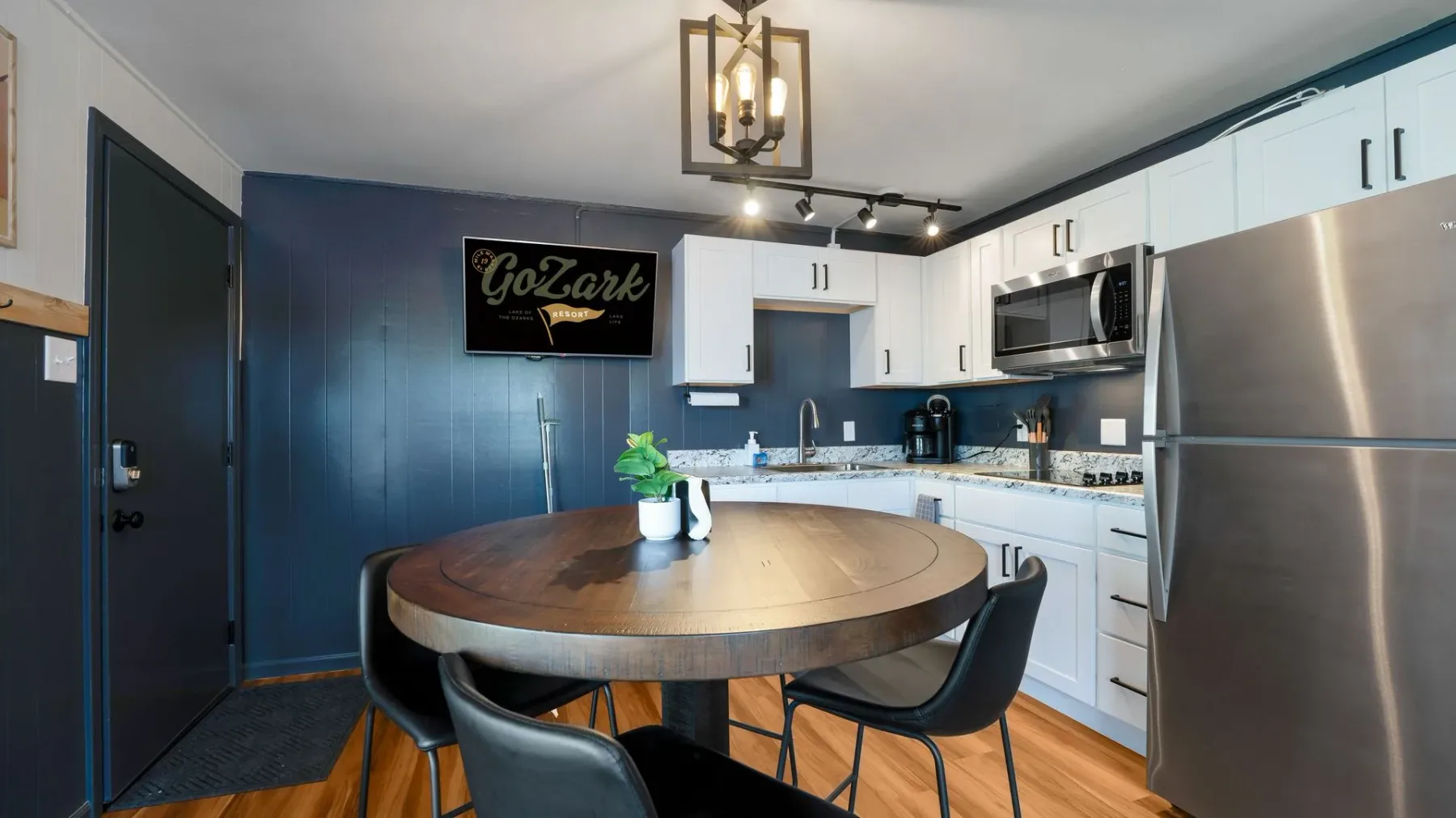 Kitchen dining nook with round wooden table