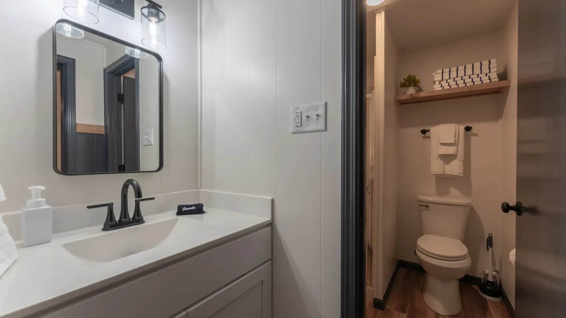 Bathroom vanity and toilet alcove