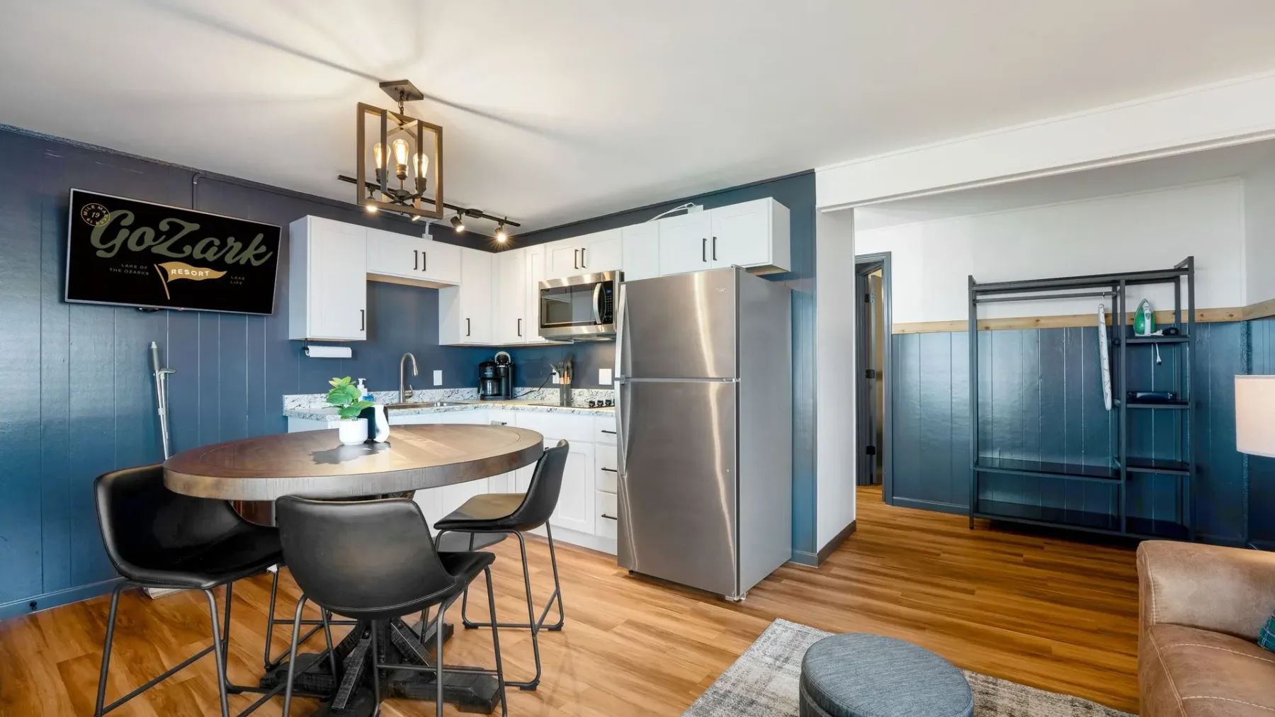 Kitchen and dining area with stainless refrigerator
