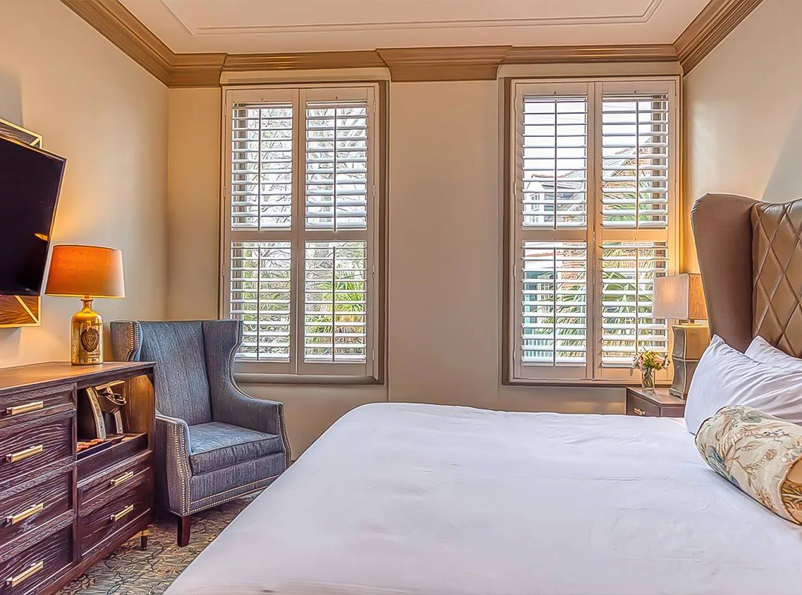Guest room with a bed and chair