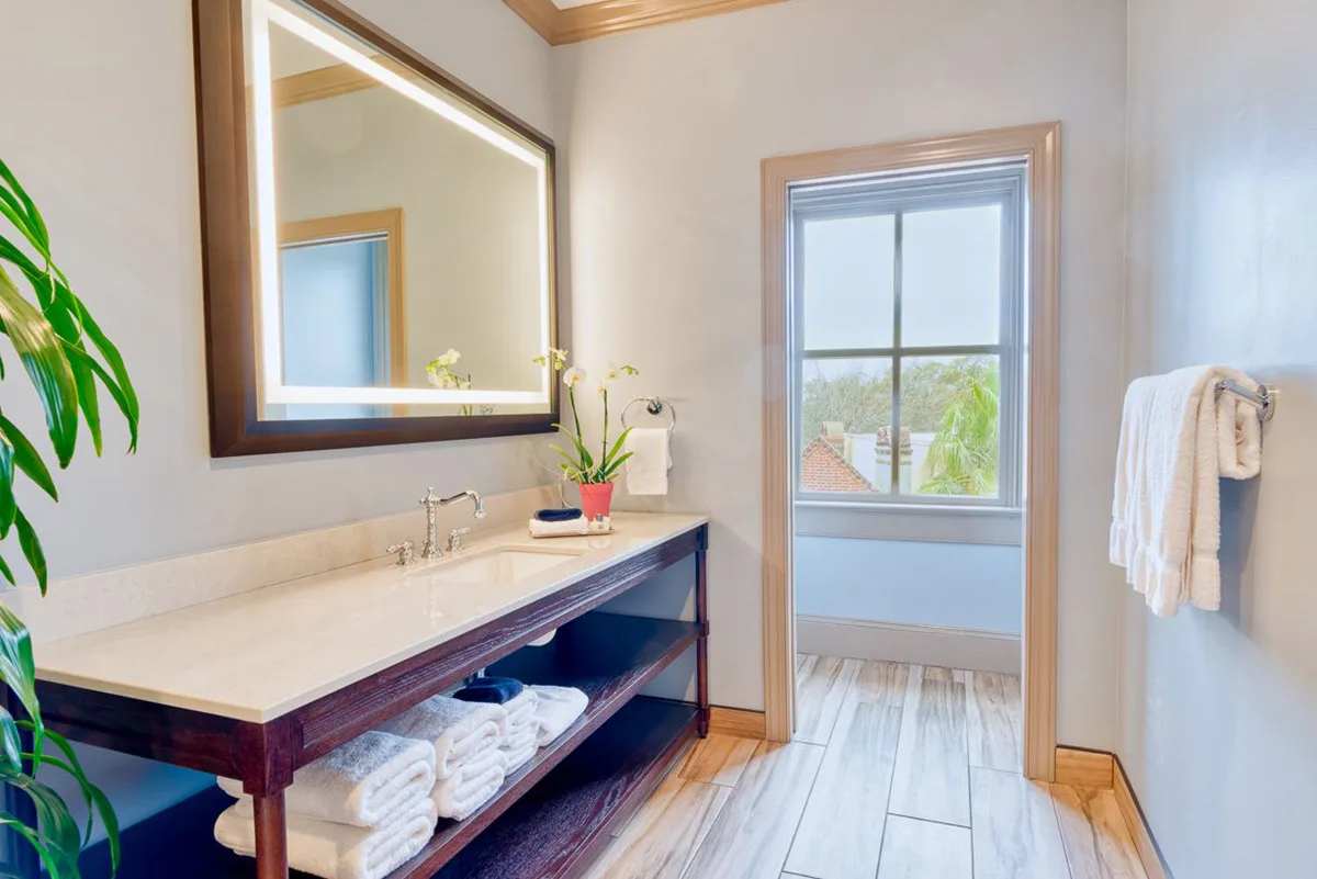 Hotel bathroom with illuminated mirror